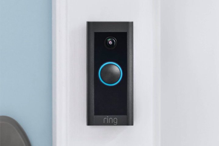 A Ring Video Doorbell Wired set up next to a front door.
