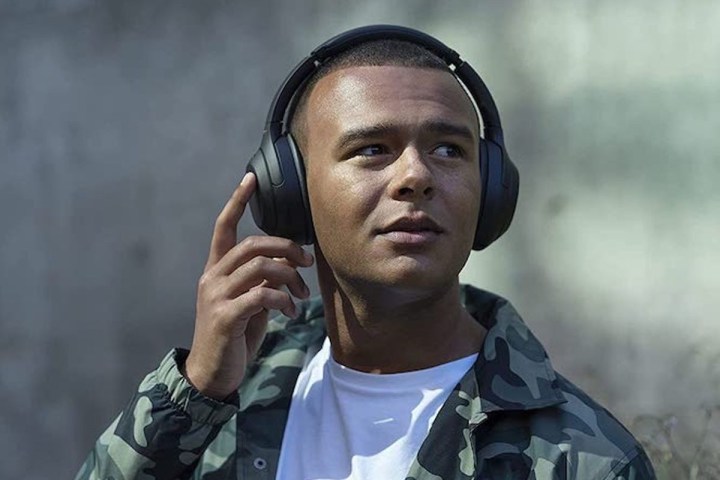 Man wearing Sony WH-1000XM4 headphones.