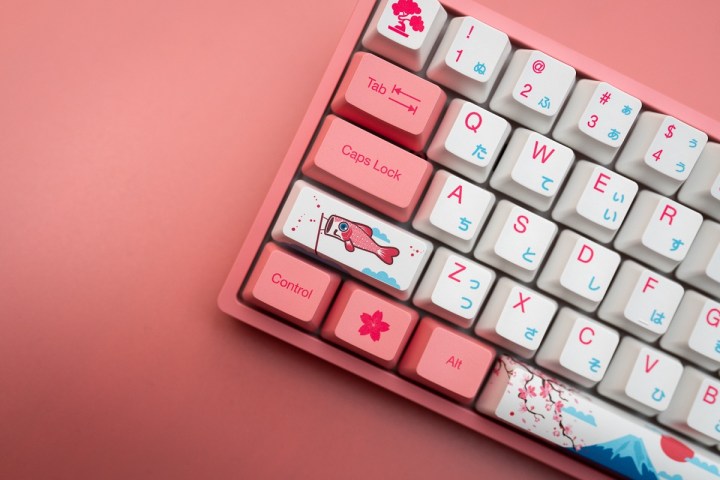A keyboard with Japanese art on the keys.