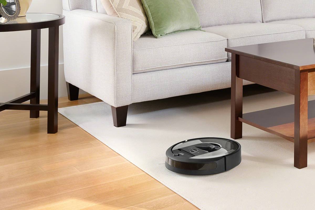 The iRobot Roomba i6 (6150) Wi-Fi Connected Robot Vacuum in a living room.