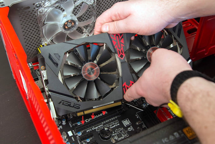 Installing a graphics card in a motherboard.