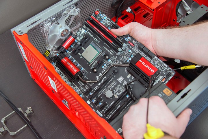 Installing a motherboard in a desktop PC case.