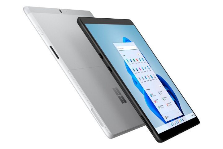 The Microsoft Surface Pro X at a side angle displaying apps on screen.