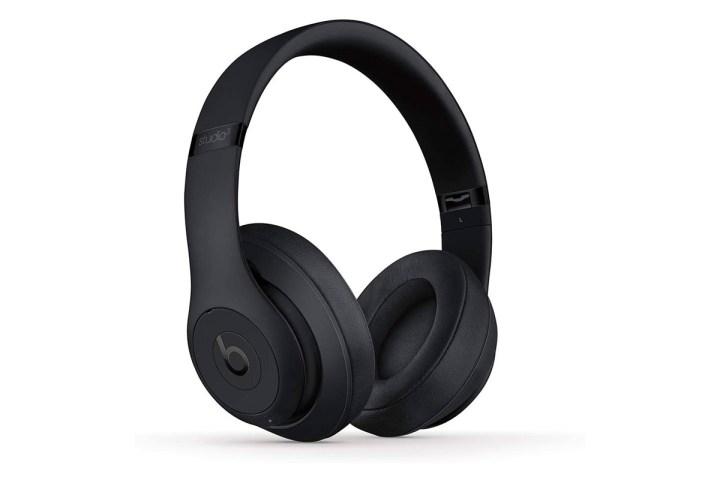 A pair of black Beats Studio3 Wireless Noise Cancelling Over-Ear Headphones stands on a white background.