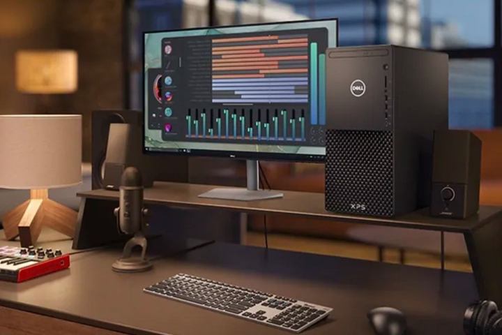 A Dell XPS Desktop next to a monitor being used for editing purposes.