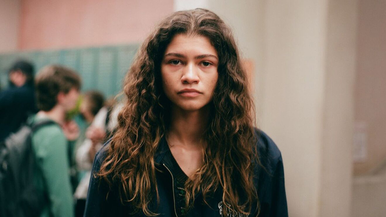 Zendaya looking straight into the camera, sad look on her face, in a scene from Euphoria season 2.