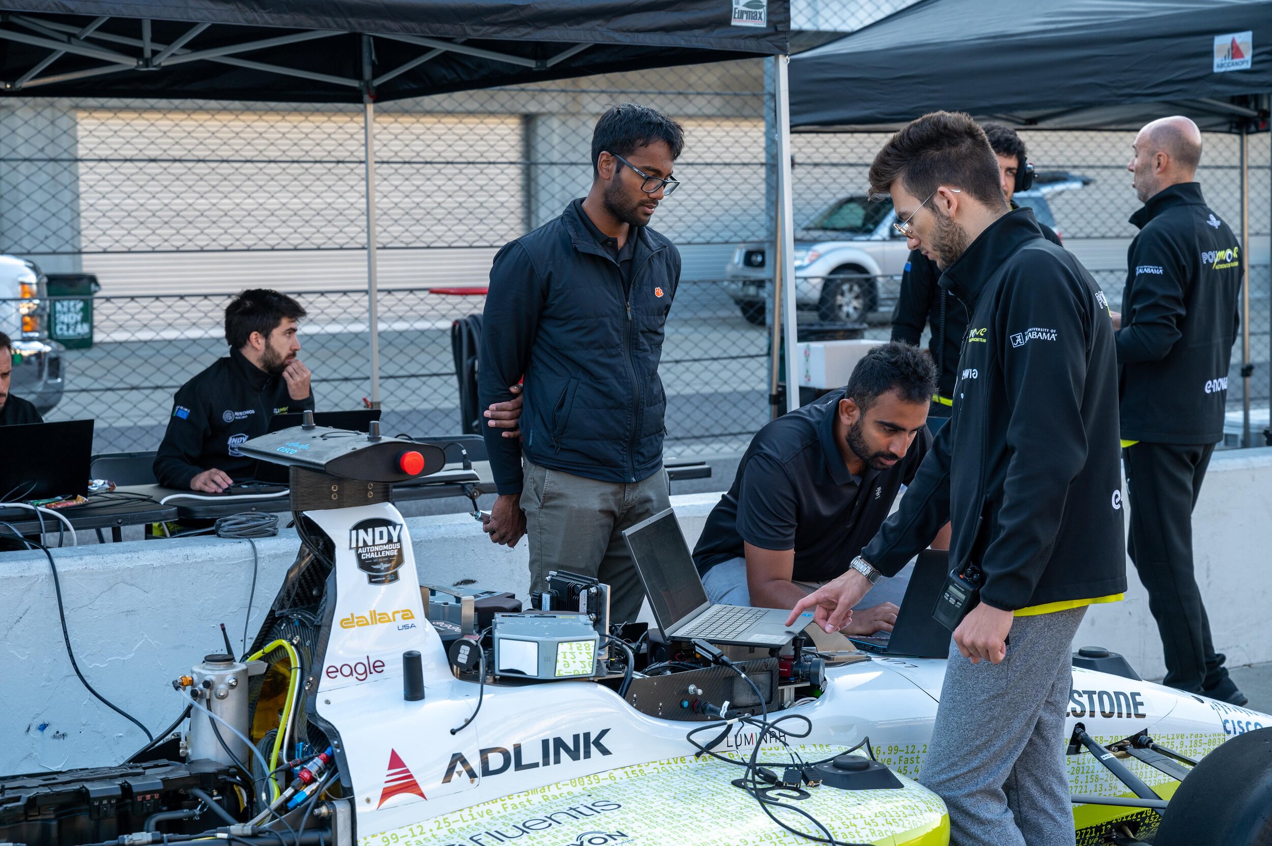 University teams working on an autonomous race car.