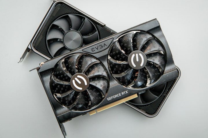 Two graphics cards sit on top of each other.