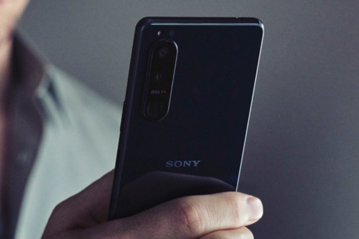 A person holding a Sony phone.