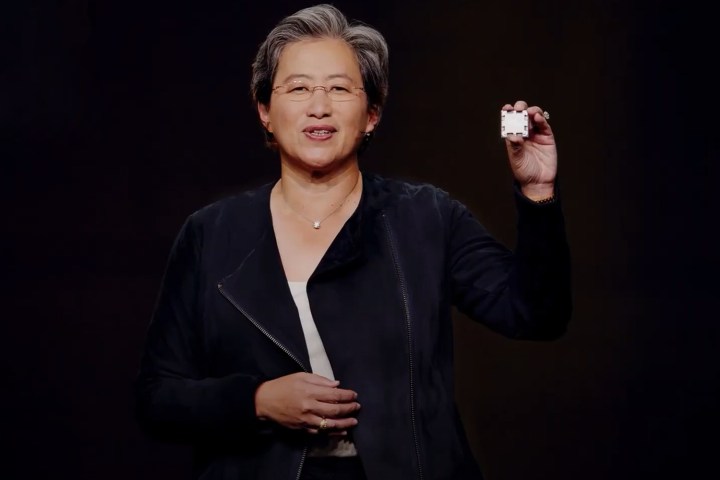 AMD CEO Lisa Su holding a Zen 4 CPU.