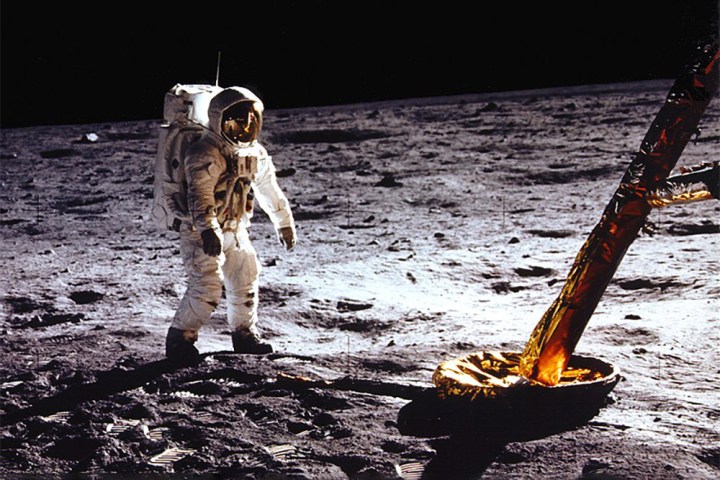 An astronaut walks on the moon during the Apollo 11 Mission.