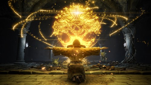 A character sits in front of a glowing, yellow orb in Elden Ring.