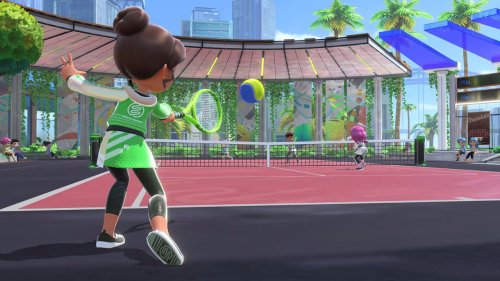 A Mii hits a tennis ball in Nintendo Switch Sports.