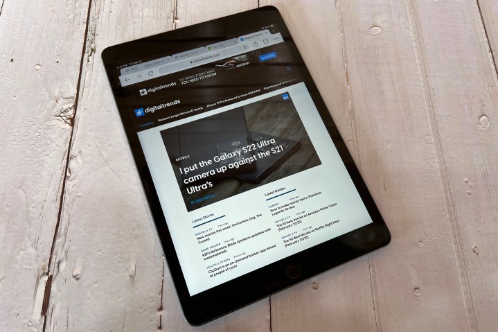 The iPad on a tablet displaying web content.