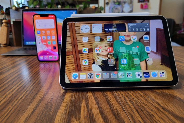 The iPad Mini placed next to an iPhone.