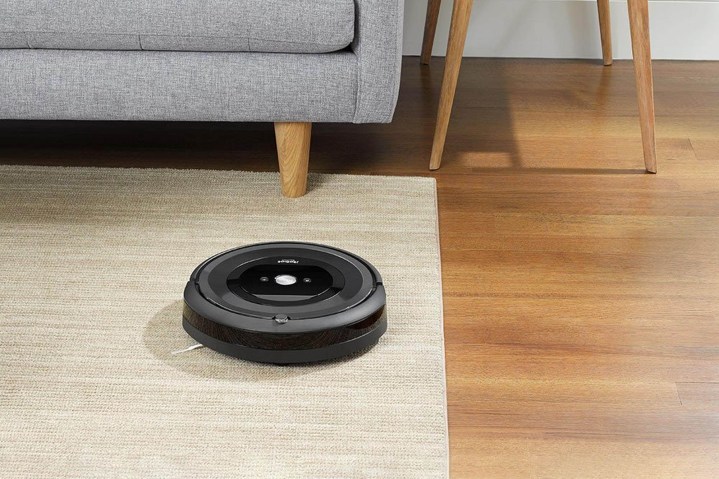 Roomba near a sofa.