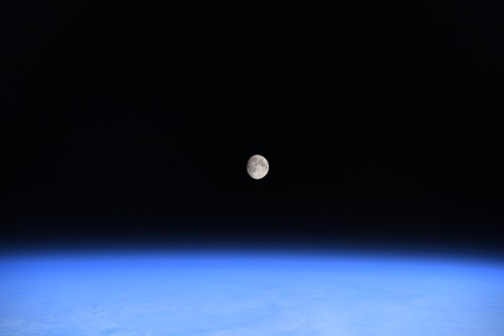 The moon and Earth seen from the space station.