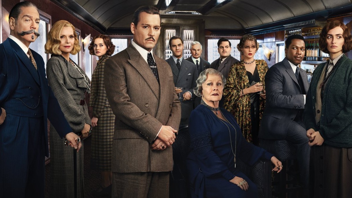 O elenco de Murder on the Orient Express posa dentro de um trem.