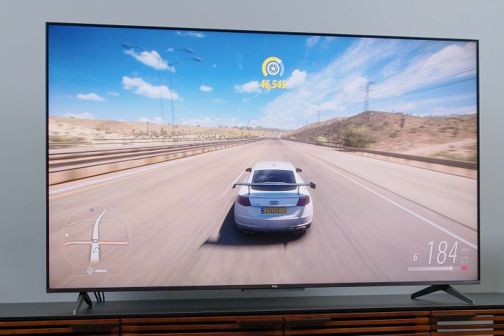 An automotive video game played on a TCL 5 Series (S546).