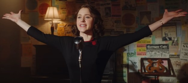 Rachel Brosnahan opens her arms onstage in The Marvelous Mrs. Maise.