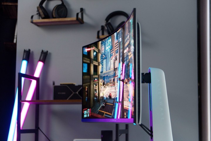 The ultrawide Alienware 34 QD-OLED against a backdrop.