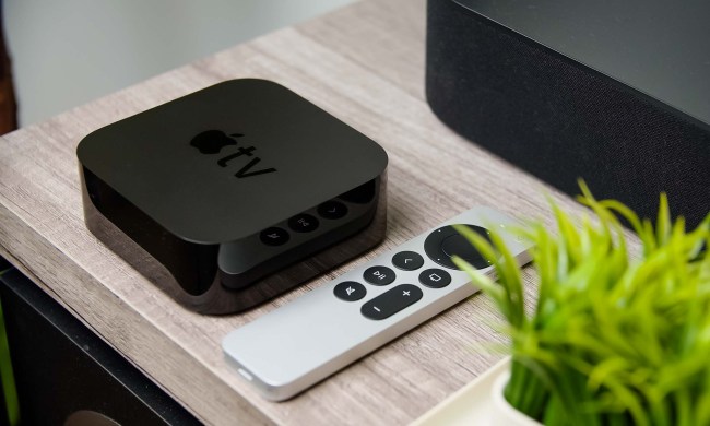 An Apple TV 4K sits on a media stand.