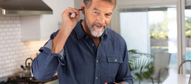 Man inserting Eargo hearing aid.