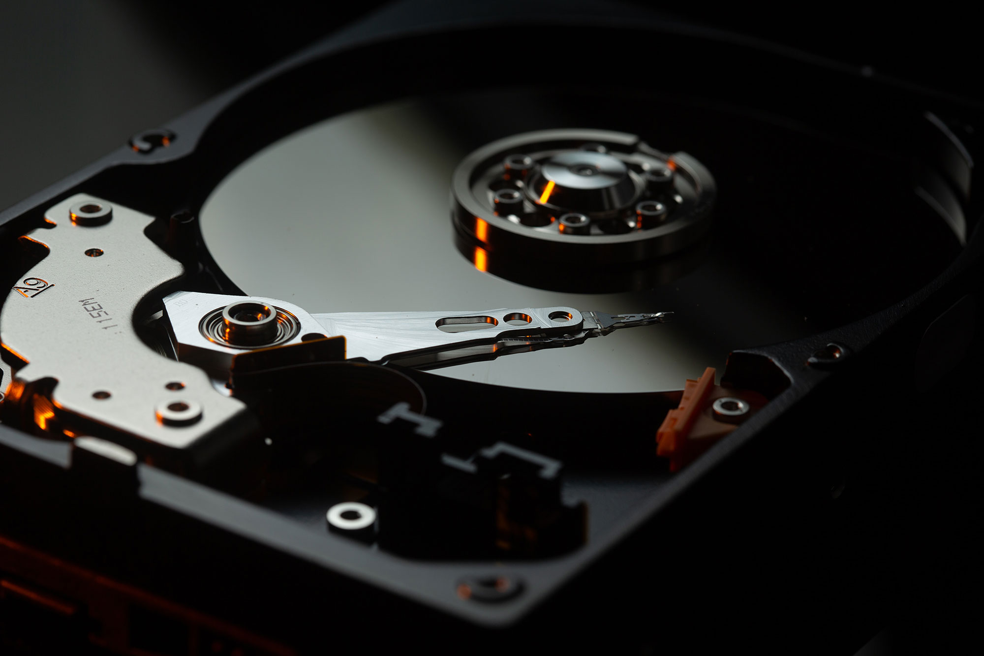 A hard disk drive that showcases the inner components.