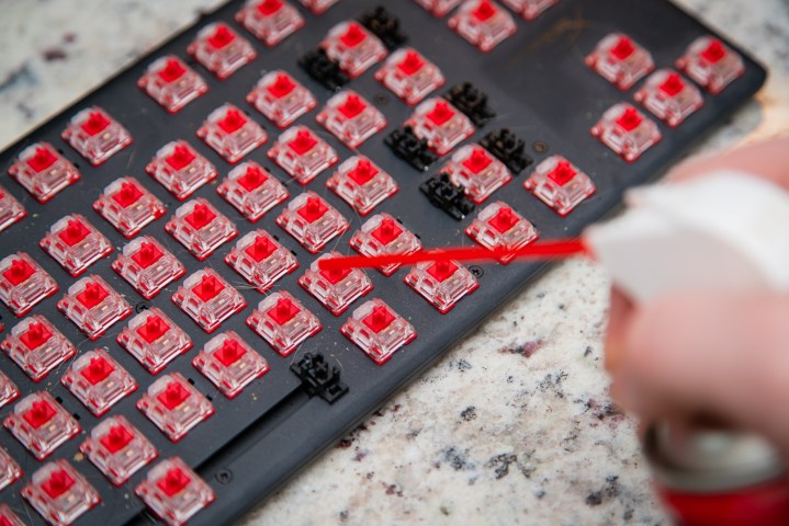 Cleaning a keyboard with compressed air