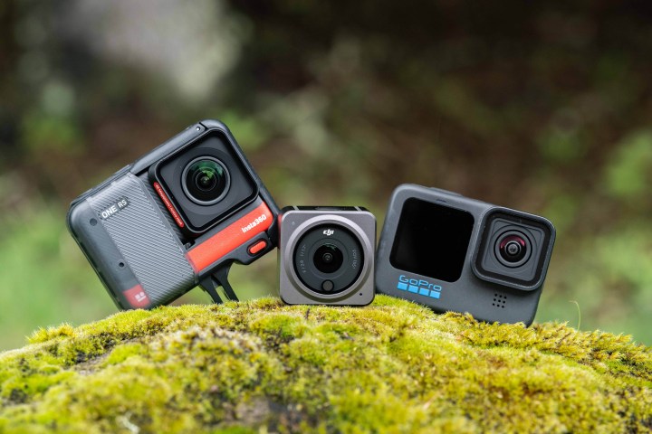 Insta360 One RS with DJI Action 2 and GoPro Hero 10 on a moss covered rock.