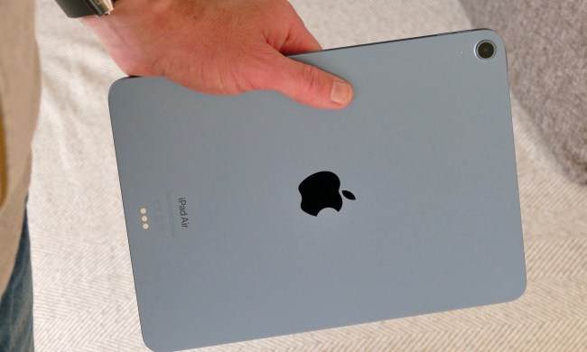 iPad Air 5 seen from the back and held in hand.