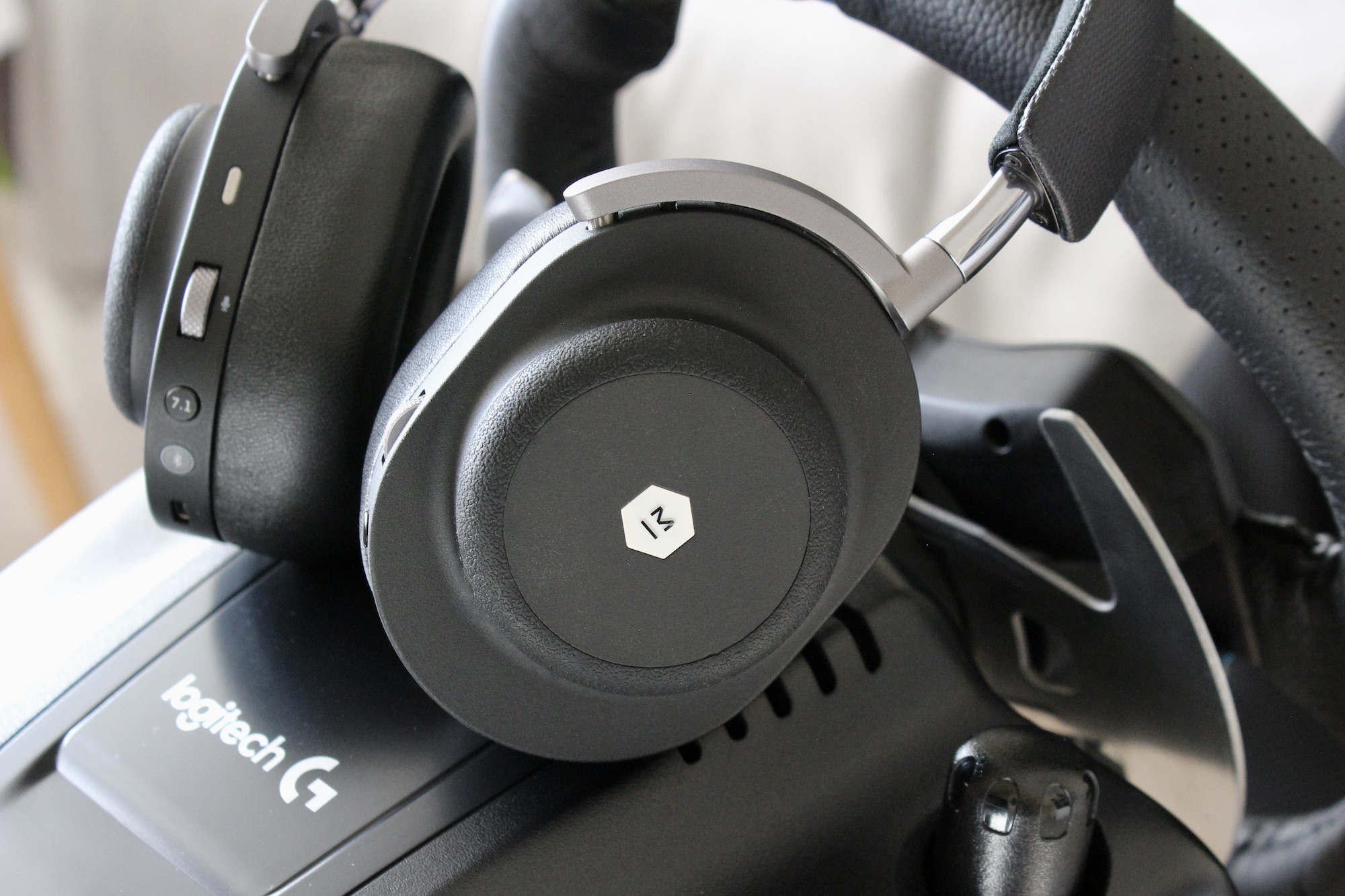 Master & Dynamic MG20 headphone cup and logo.