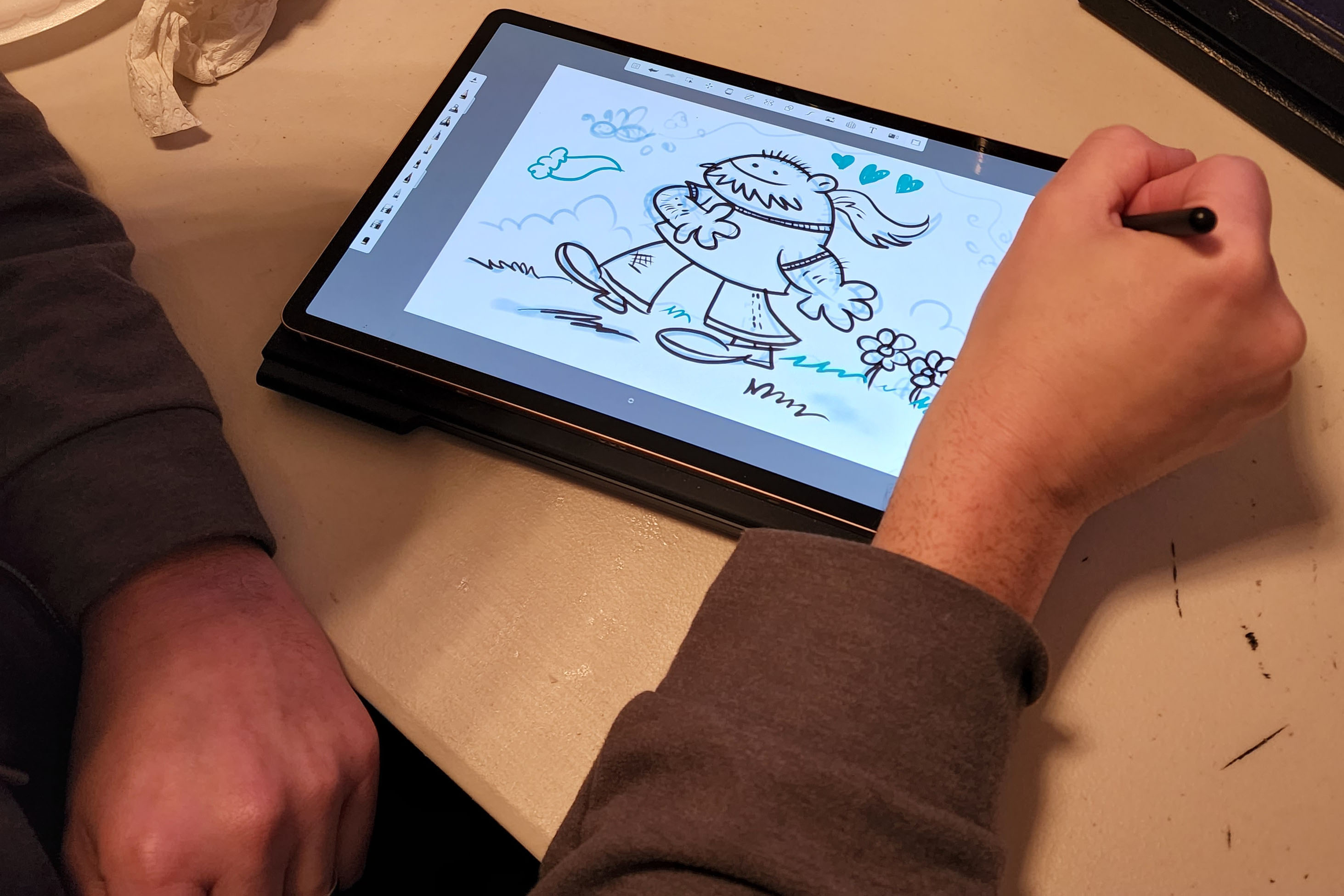 A famous cartoonist sketches on a Samsung Galaxy Tab S9+.