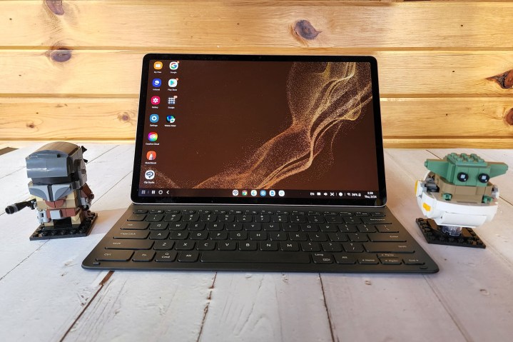 The Samsung Galaxy Tab S8+ sits on a table with two lego minifigs.