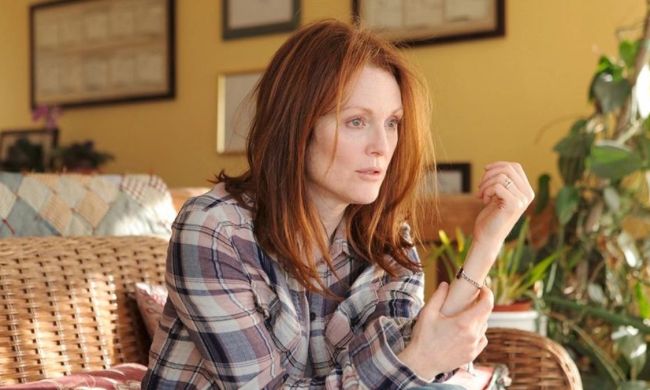 Alice looking confused while sitting on a wicker couch in Still Alice.