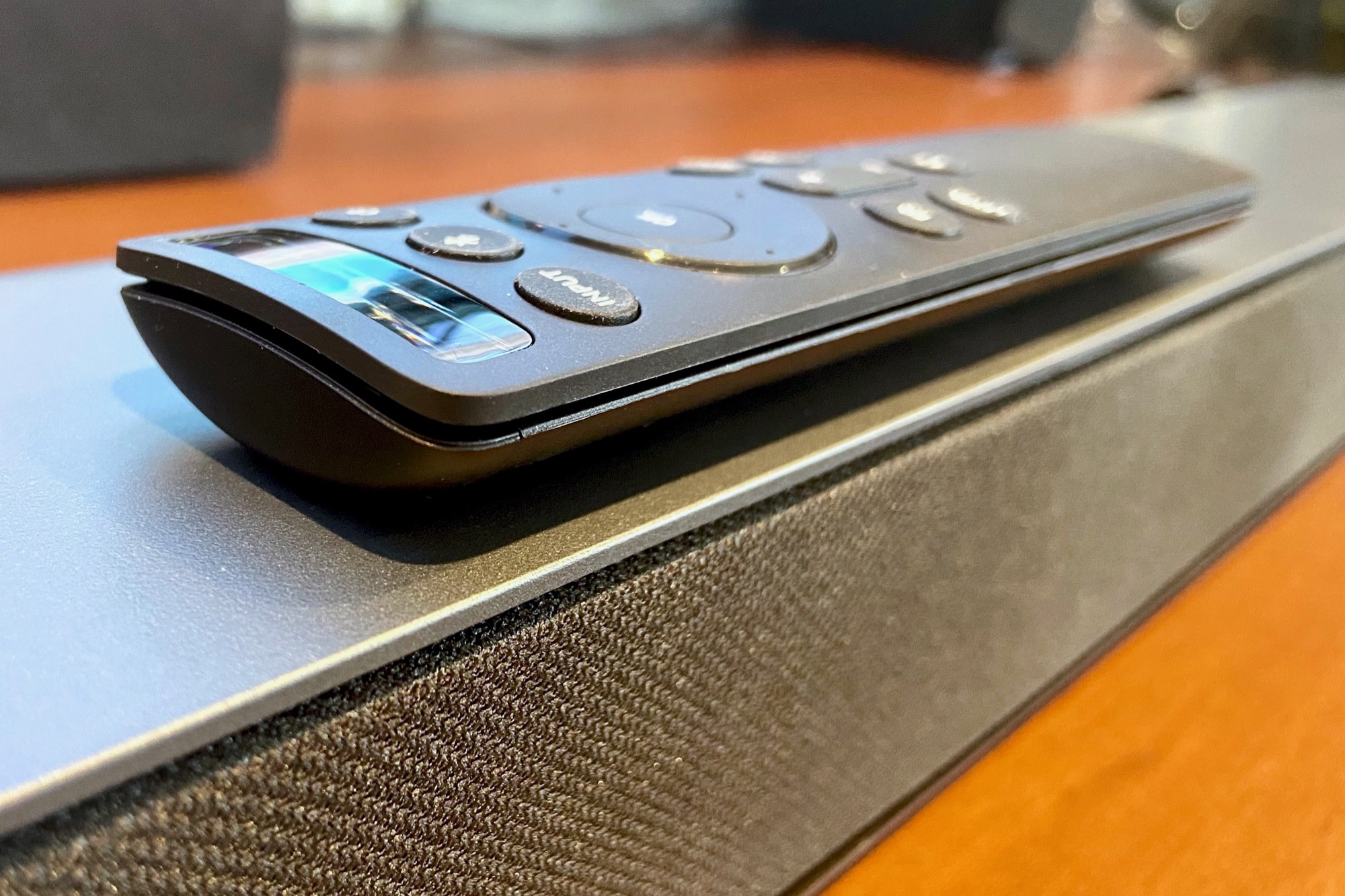 Vizio M-Series 2.1 soundbar seen with its included remote.