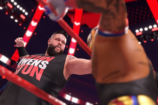 Kevin Owens punches Rey Mysterio in WWE 2K22.