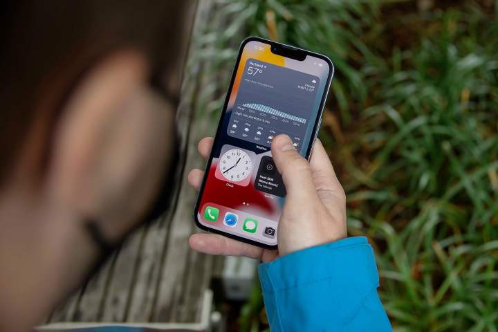 A person using the Apple iPhone 13 Pro.