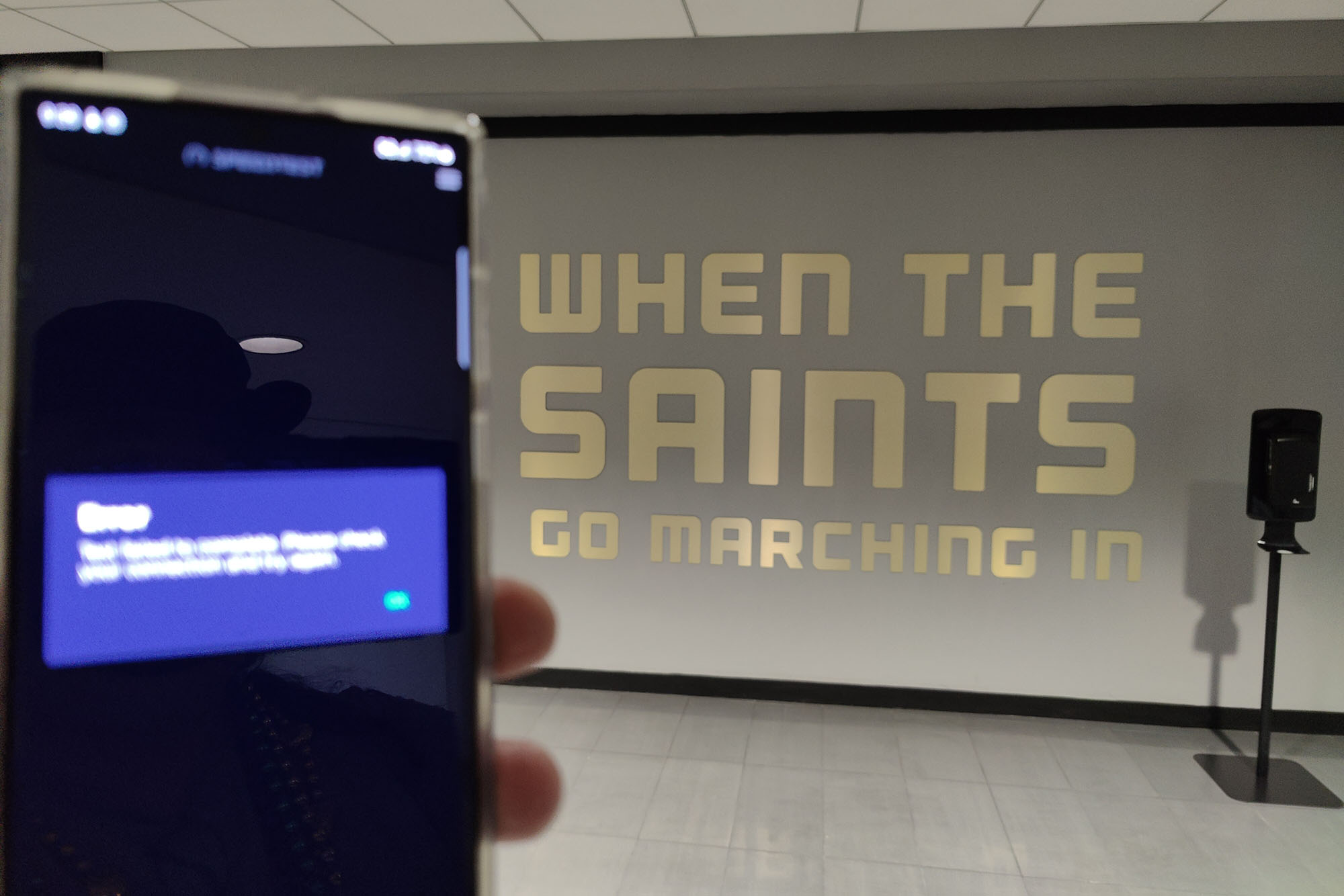 5G test with the Saints logo in the background.