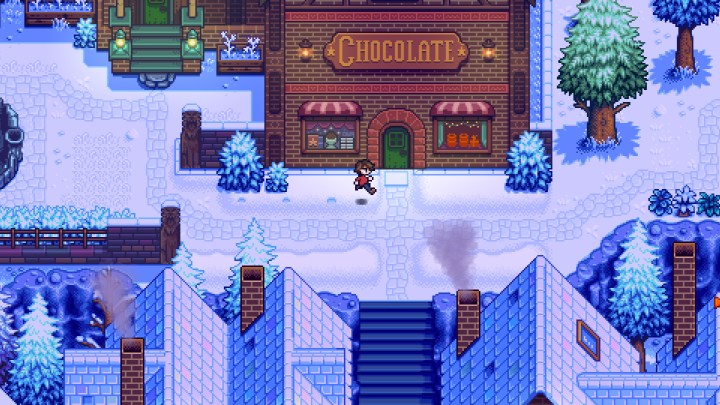 Character running past a chocolate factory in Haunted Chocolatier.