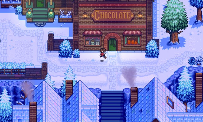 Character running past a chocolate factory in Haunted Chocolatier.