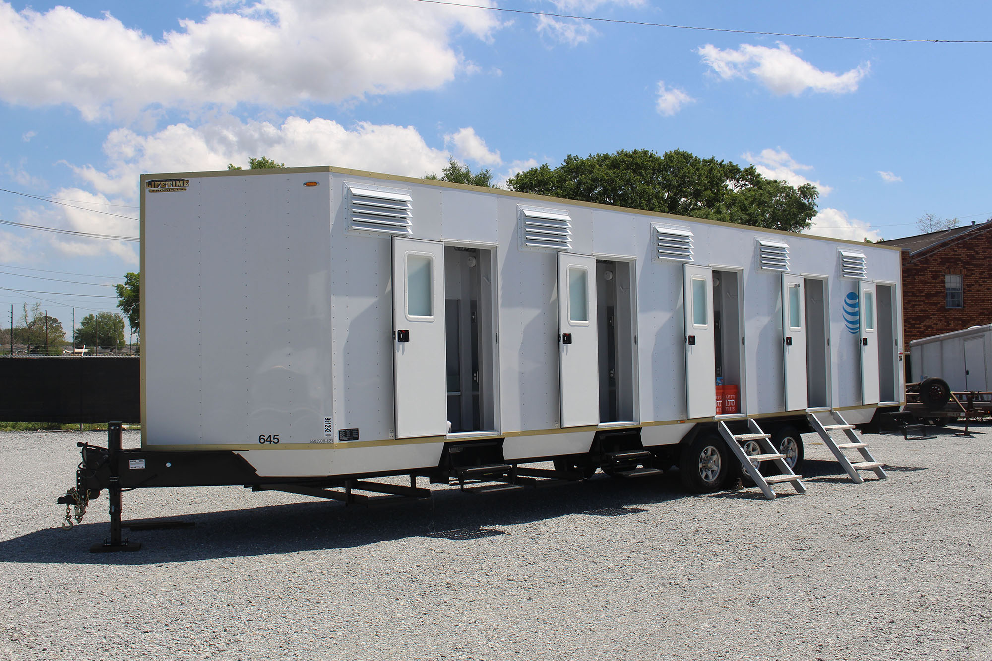 The AT&T mobile bunkhouse with doors open.