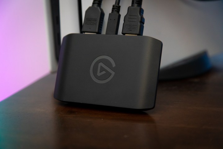 The Elgato HD60 X capture card leaning against a PS5.