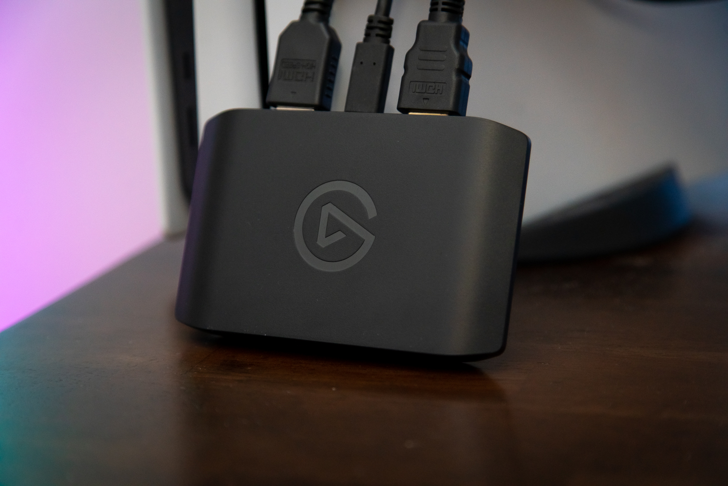 The Elgato HD60 X capture card leaning against a PS5.
