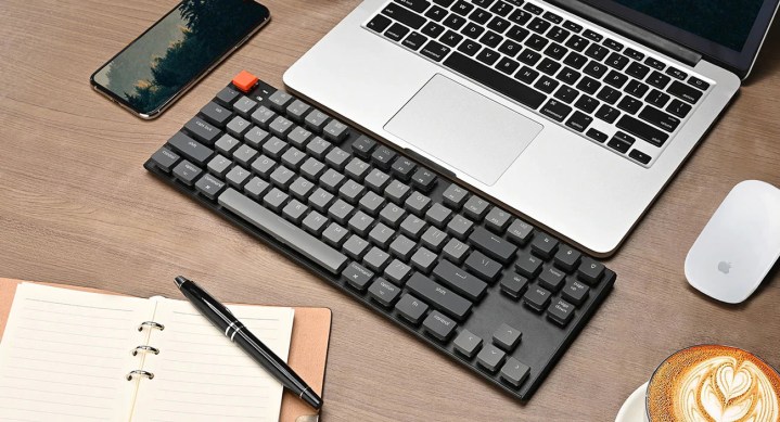 Keychon K1 keyboard in front of a laptop,.
