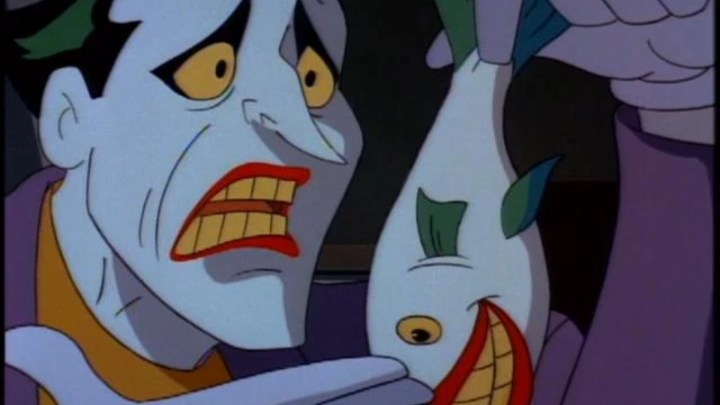 Joker tiene in mano uno dei suoi pesci ridenti titolari in BTAS.