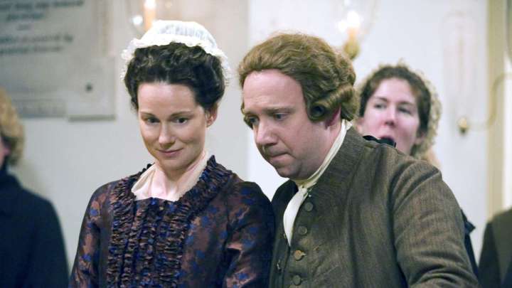 Laura Linney e Paul Giamatti em John Adams.