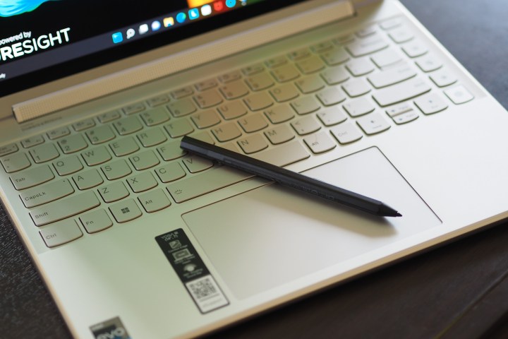 The Lenovo Yoga 9i 14 Gen 7 keyboard and stylus in a top-down view.