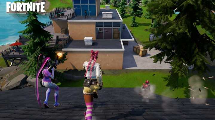Three characters sprinting on a roof in Fortnite.
