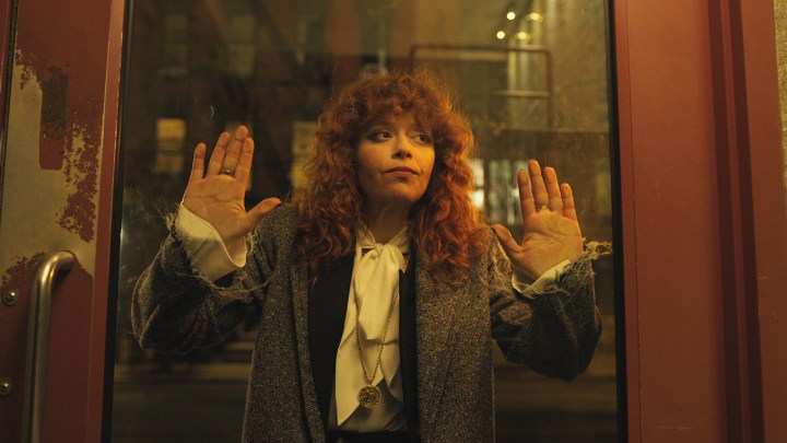 Natasha Lyonne as Nadya in Russian Doll, her face pressed against a subway door.